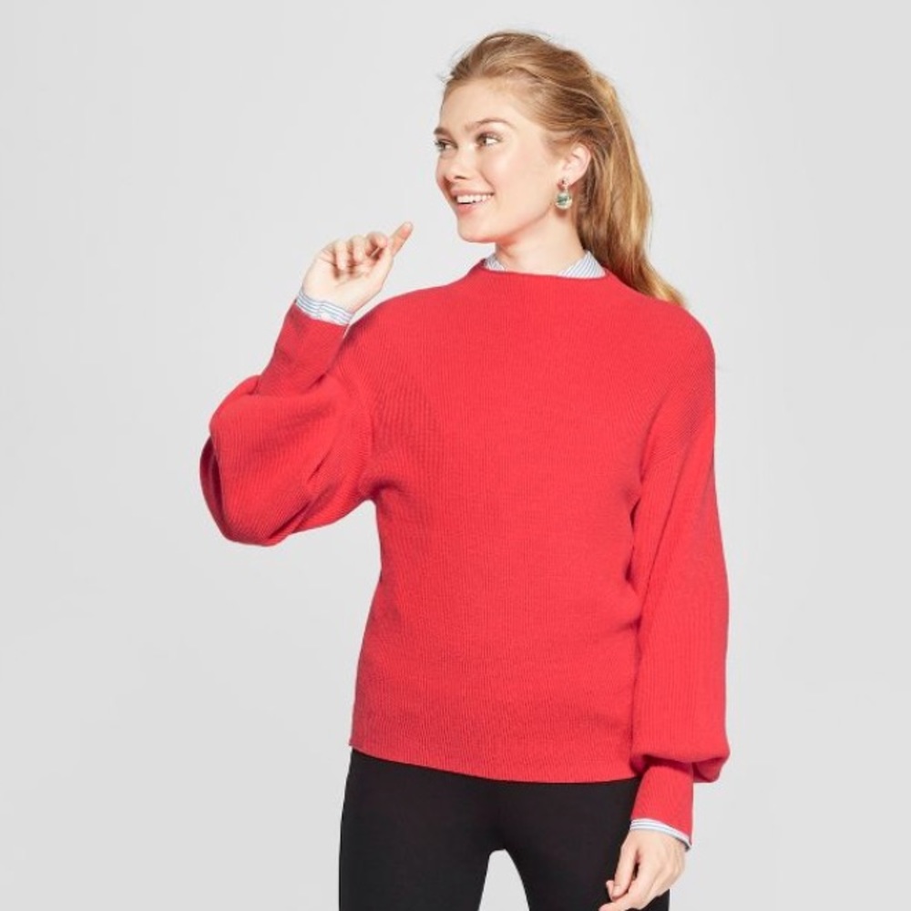 A New Day red sweater